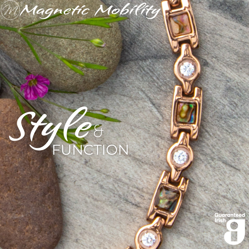 Avens Dawn 4in1 magnetic bracelet displayed on natural rocks and flowers, highlighting its style and functionality by Magnetic Mobility.