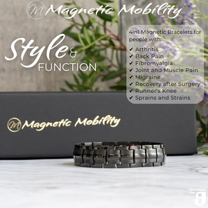 
                  
                    Load image into Gallery viewer, Front view of the Ashe Night Double strength 4in1 magnetic bracelet by Magnetic Mobility, promoting arthritis, back pain, fibromyalgia relief with a stylish black design. The bracelet is shown in front of its luxury Black gift box and flowers.
                  
                