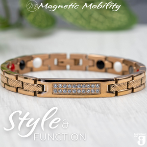 
                  
                    Load image into Gallery viewer, Front view of the Honesty Dawn 4in1 Magnetic Bracelet from Magnetic Mobility in rose gold finish. Features a central panel with sparkling crystals and includes Neodymium Magnets, FIR elements, Germanium, and Negative Ions for therapeutic benefits. The bracelet is shown in front of a green plant.
                  
                