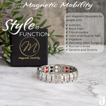 Front view of the Ashe Star Double strength 4in1 magnetic bracelet by Magnetic Mobility, promoting arthritis, back pain, fibromyalgia relief with a stylish black design. The bracelet is shown in front of its luxury Black gift box and flowers.