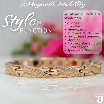 Front view of the Snapdragon Dawn 4in1 Magnetic Bracelet, rose gold coloured bracelet with snakeskin type designs, designed for pain relief, featuring various therapeutic elements. The bracelet is shown on a reflective surface with a pink flower behind it. 