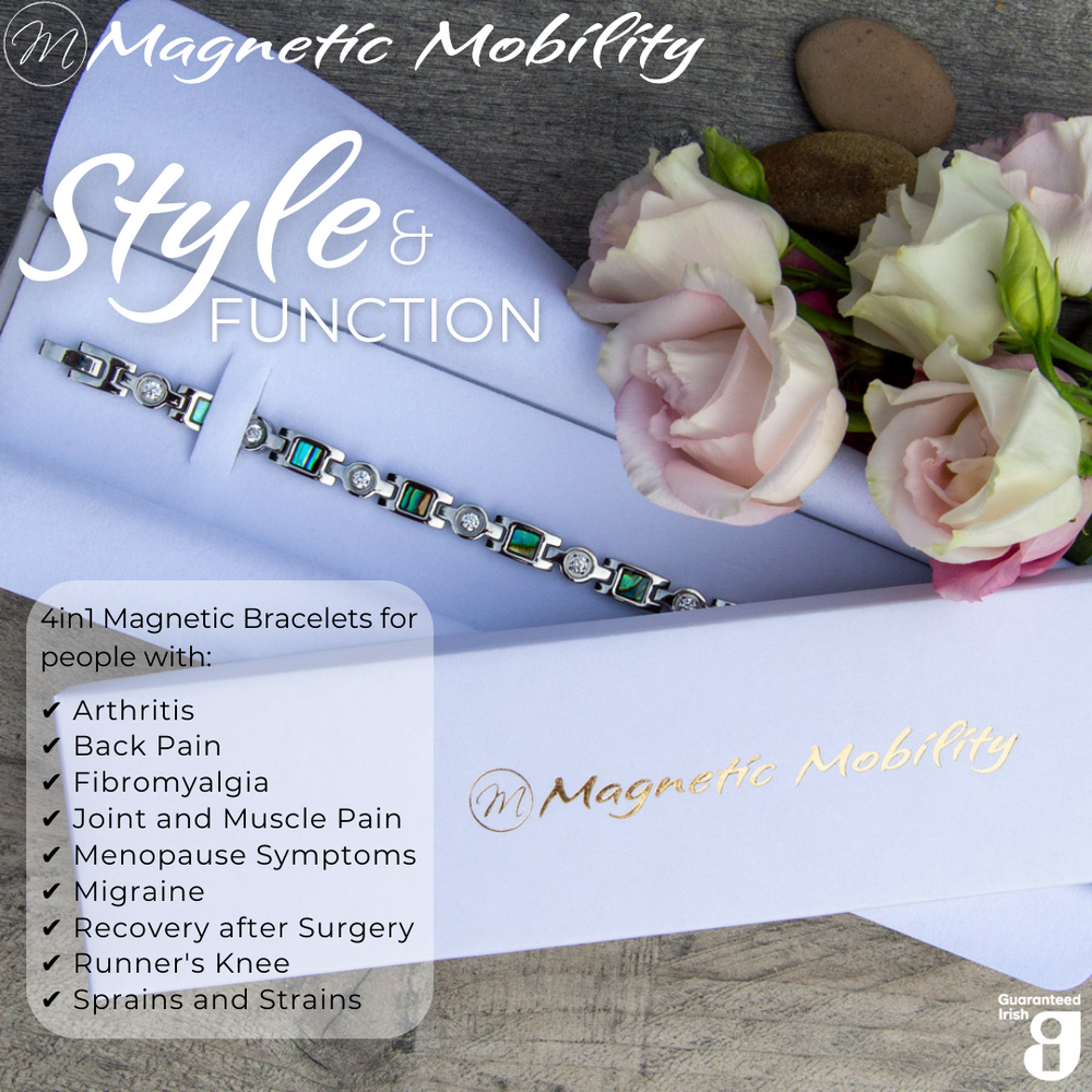 
                  
                    Load image into Gallery viewer, Avens Star 4in1 magnetic bracelet by Magnetic Mobility, packaged elegantly with flowers. Features neodymium magnets, FIR elements, germanium, and negative ions. Designed to relieve arthritis, back pain, fibromyalgia, joint and muscle pain, menopause symptoms, migraine, recovery after surgery, runner&amp;#39;s knee, sprains and strains
                  
                