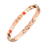 Snapdragon Dawn 4in1 Magnetic Bracelet from Magnetic Mobility in rose gold finish. Features an elegant, textured design and includes Neodymium Magnets, FIR elements, Germanium, and Negative Ions for therapeutic benefits. Suitable for relieving arthritis, back pain, fibromyalgia, joint and muscle pain, menopause symptoms, migraines, post-surgery recovery, runner's knee, sprains, and strains.