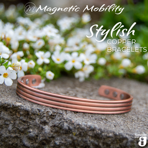 
                  
                    Load image into Gallery viewer, Close up view of the 3 neodymium magnets on 1 side of the heath copper bracelet from Magnetic Mobility. The copper bracelet is featured on a stone surface in a garden signifying its popularity among gardeners for helping combat aches and pains. Text states &amp;quot; Stylish Copper Bracelets&amp;quot; and the image features the Guaranteed Irish Logo. 
                  
                