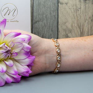 
                  
                    Load image into Gallery viewer, Angelica&amp;#39;s Dawn 4in1 Magnetic Bracelet from Magnetic Mobility worn on a wrist, highlighting Swarovski crystals and rose gold design. Includes 4in1 elements: neodymium magnets, FIR elements, germanium, and negative ions for stylish pain relief.
                  
                