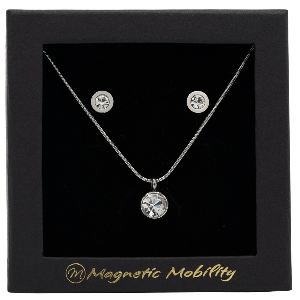 
                  
                    Load image into Gallery viewer, April Magnetic Mobility Birthstone Gift Set featuring a Magnetic Necklace and Stud Earrings featuring clear Swarovski crystals, elegantly presented in a black box with Magnetic Mobility branding. These magnetic back earrings offer stylish pain relief.
                  
                