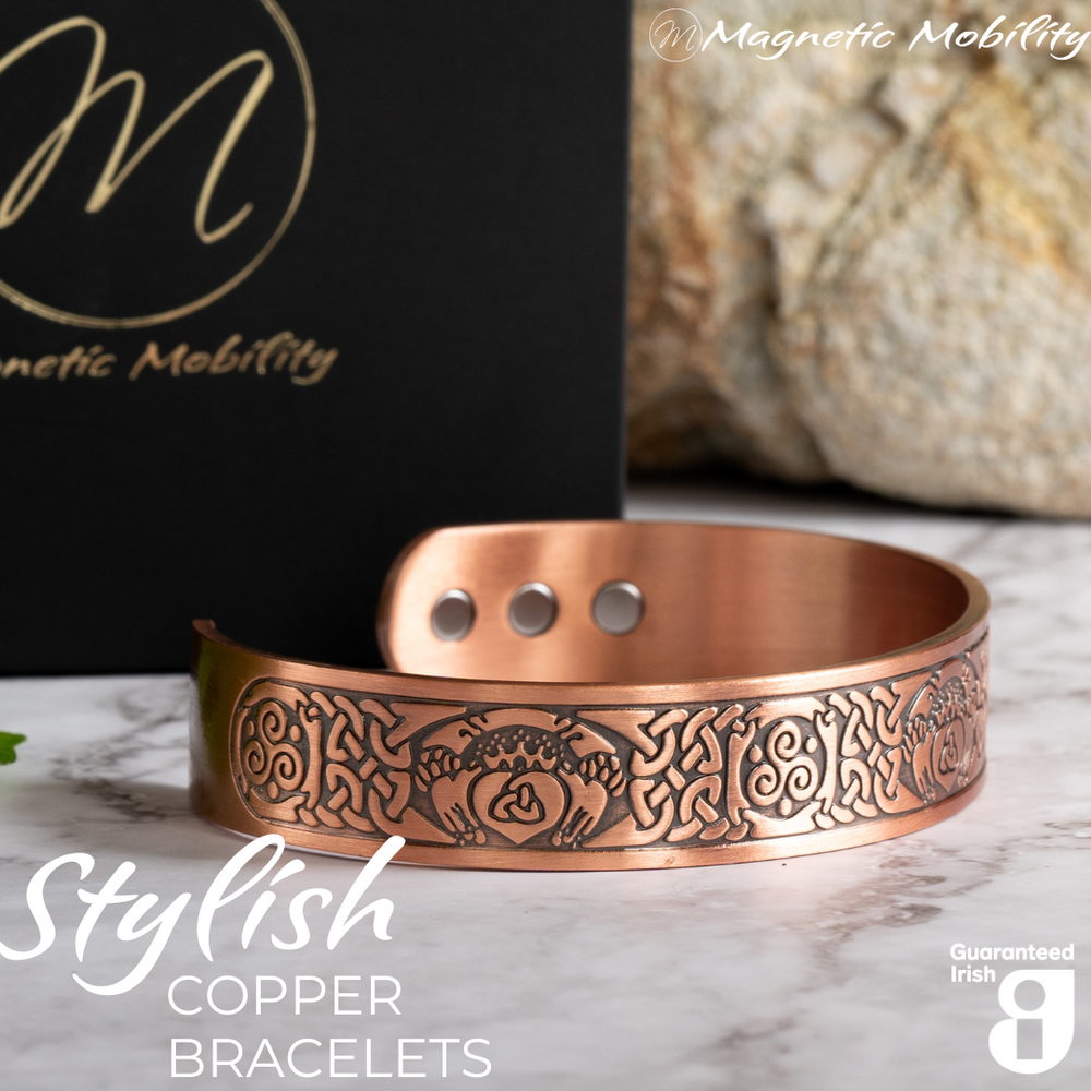 
                  
                    Load image into Gallery viewer, Close up view of the Claddagh design on this Claddagh Copper Magnetic Bracelet from Magnetic Mobility. 3 Magnets are also visible on the back of the bracelet. 
                  
                