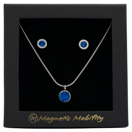 December Magnetic Mobility Birthstone Gift Set featuring a Magnetic Necklace and Stud Earrings featuring Blue Swarovski crystals, elegantly presented in a black box with Magnetic Mobility branding. These magnetic back earrings offer stylish pain relief.