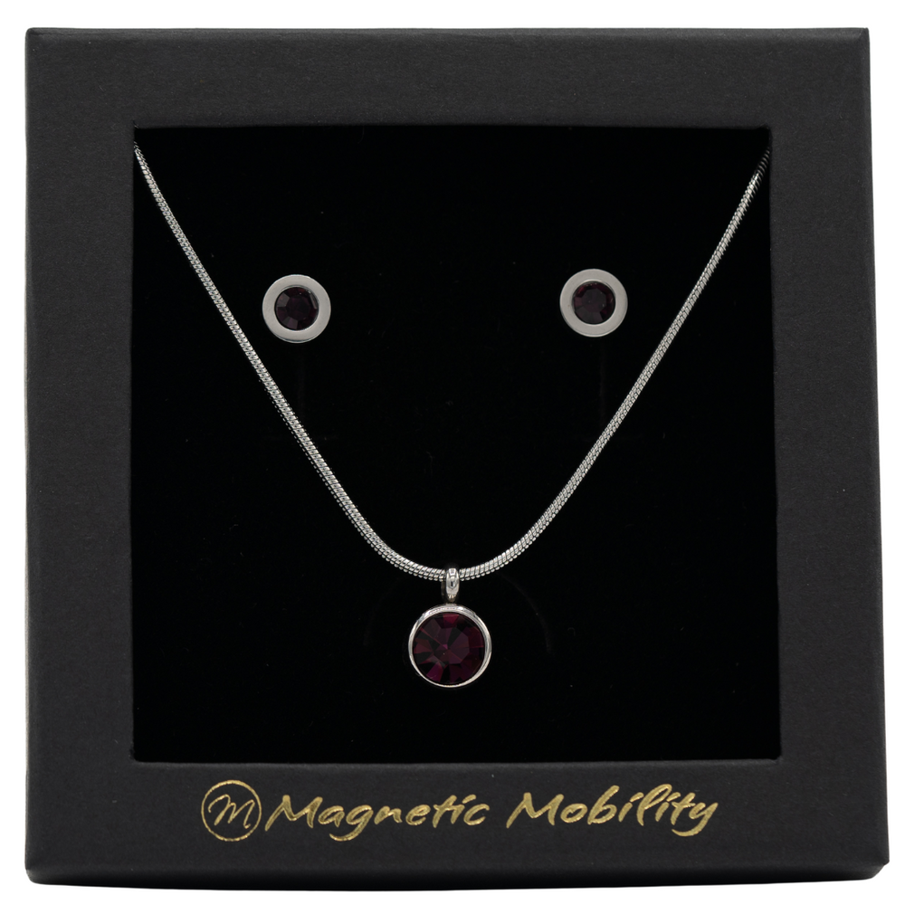 
                  
                    Load image into Gallery viewer, February Magnetic Mobility Birthstone Gift Set featuring a Magnetic Necklace and Stud Earrings featuring amethyst purple Swarovski crystals, elegantly presented in a black box with Magnetic Mobility branding. These magnetic back earrings offer stylish pain relief.
                  
                