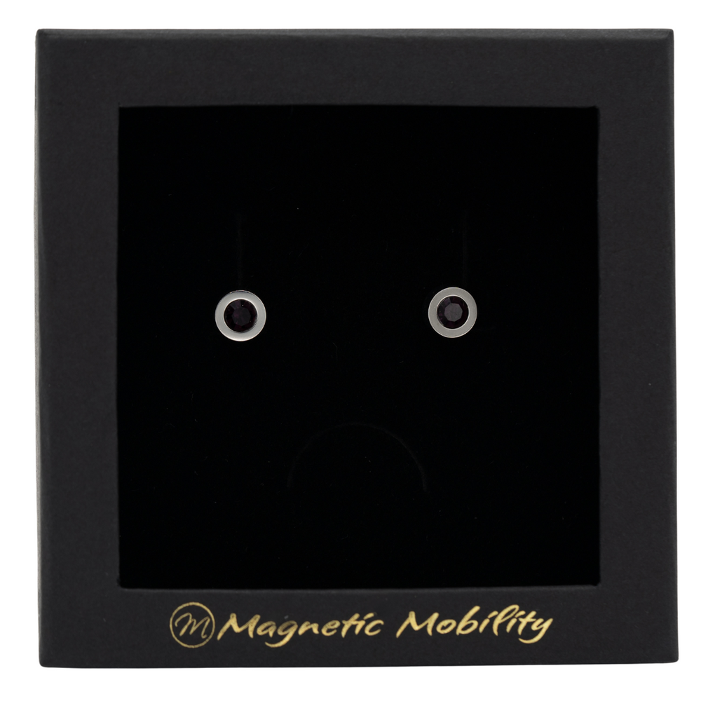 
                  
                    Load image into Gallery viewer, Magnetic Mobility February Birthstone Stud Earrings featuring amethyst Swarovski crystals, elegantly presented in a black box with Magnetic Mobility branding. These magnetic back earrings offer stylish pain relief.
                  
                