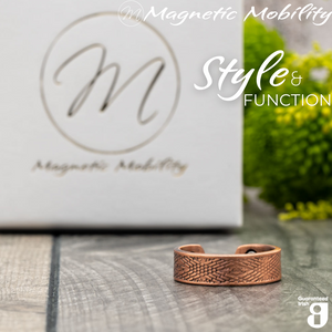 
                  
                    Load image into Gallery viewer, Hawthorn copper ring by Magnetic Mobility featuring an intricate geometric design. Ring is shown in front of a white branded gift box. This adjustable ring is designed to be easily worn on arthritic fingers, providing both style and functionality.
                  
                