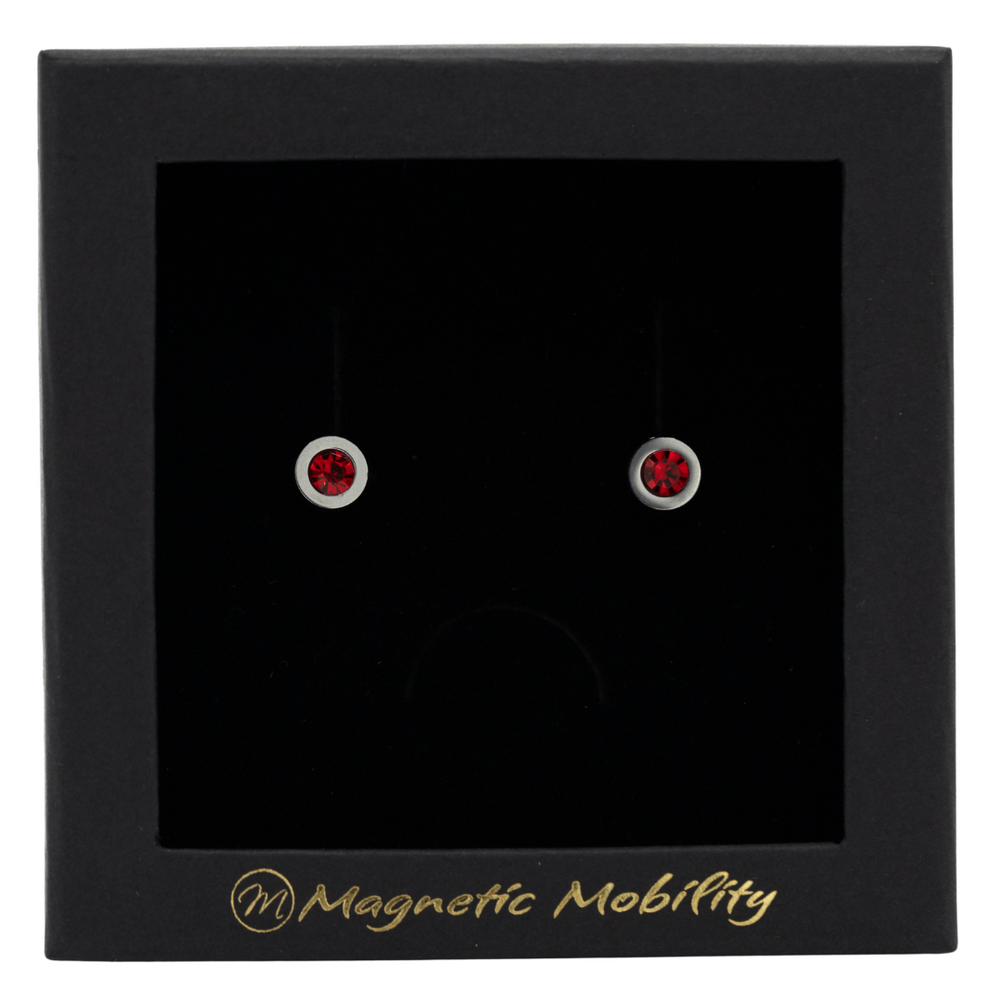 
                  
                    Load image into Gallery viewer, Magnetic Mobility January Birthstone Stud Earrings featuring garnet red Swarovski crystals, elegantly presented in a black box with Magnetic Mobility branding. These magnetic back earrings offer stylish pain relief.
                  
                