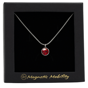 
                  
                    Load image into Gallery viewer, January Magnetic Mobility Birthstone Necklace featuring a red Swarovski crystal pendant with a magnetic back. Ideal for relieving neck pain, elegantly presented in black packaging with Magnetic Mobility branding.
                  
                