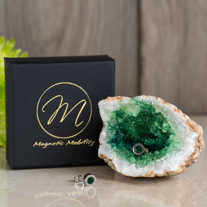 
                  
                    Load image into Gallery viewer, Birthstone Stud Earrings from Magnetic Mobility with green Emerald Swarovski crystals. These magnetic back earrings are perfect for fashionable pain relief and are beautifully presented with a geode and branded box.
                  
                