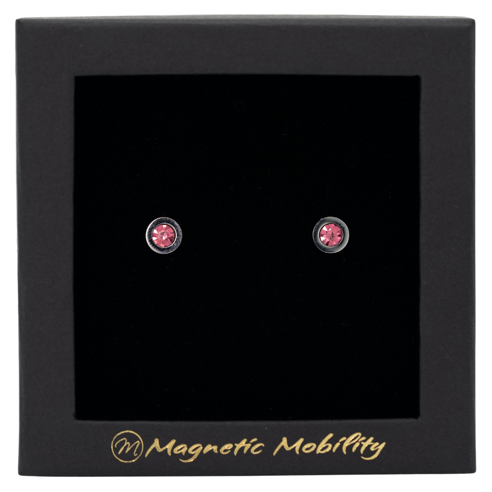 
                  
                    Load image into Gallery viewer, Magnetic Mobility October Birthstone Stud Earrings featuring pink tourmailne Swarovski crystals, elegantly presented in a black box with Magnetic Mobility branding. These magnetic back earrings offer stylish pain relief.
                  
                