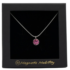 
                  
                    Load image into Gallery viewer, October Magnetic Mobility Birthstone Necklace featuring a pink Swarovski crystal pendant with a magnetic back. Ideal for relieving neck pain, displayed in a black box with Magnetic Mobility logo.
                  
                