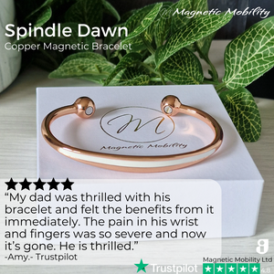 
                  
                    Load image into Gallery viewer, A copper bracelet with a simple design and an white band in the centre. The bracelet is shown on a white gift box with a green plant behind it.  Featuring 2 strong neodymium magnets. Perfect for people with arthritis and back pain. 99% pure copper. Customer review written on the image from Trustpilot stating &amp;quot;My Dad was thrilled with his bracelet and felt the benefits immediately. The pain in his wrist and fingers was so severe and now it&amp;#39;s gone.&amp;quot;. 
                  
                